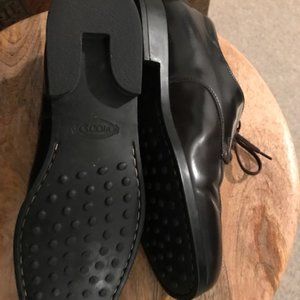 TOD'S women's classic lace-up in dark brown.